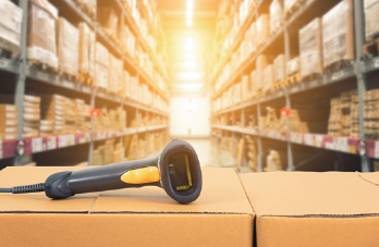 stock image of barcode scanner in a warehouse